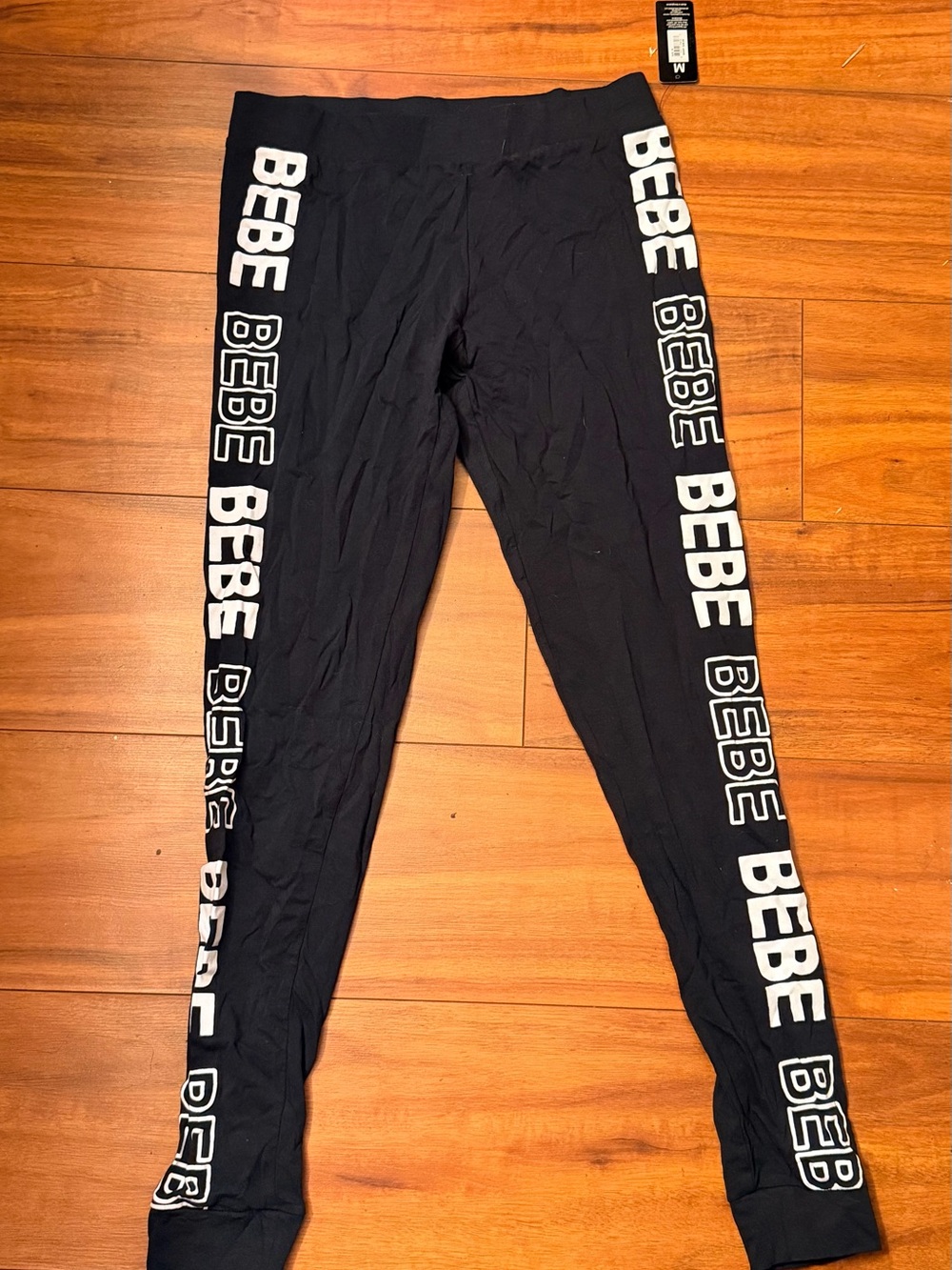 bebe Black Leggings with White Side Logo Stripes